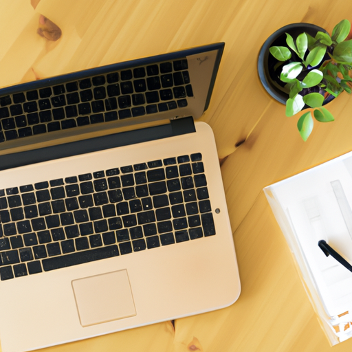 An image showing a well-organized workspace with a laptop, notebook, and plant, symbolizing a productive work environment.